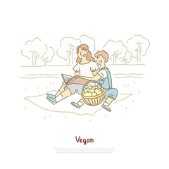 Cheerful vegan mother with son, family outdoor rest, woman reading book, fresh apples in basket, vitamin diet banner