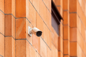 Video camera security system on the wall of the building. The concept of video surveillance, surveillance.