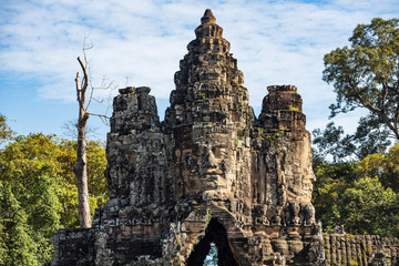 The magnificent  south gate leading to the Angkor Thom temple complex, famous for the multi faced...