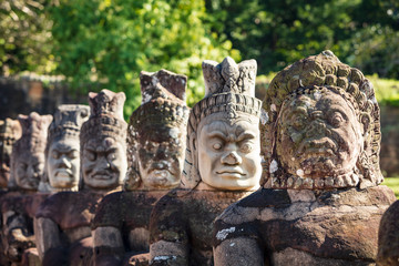 Head sculptures on the bridge leading to the south gate at Angkor Thom temple complex, Siem Reap, Cambodia