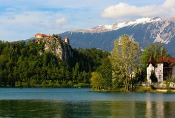 Fototapeta na wymiar Bled castle (Blejskj grad) on lake Bled (Slovenia), on the background the Julian Alps