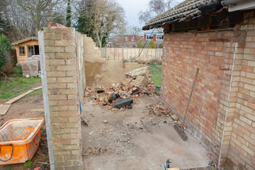 Demolition works in the residential property, destroyed garage, rubble and blocks