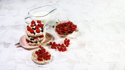 Snack with crispbread, cream cheese and fresh fruits on white background. Healthy food concept. Flat lay, top view