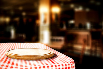 White and red tablecloth with kitchen desk and free space for your decoration. Restaurant interior 