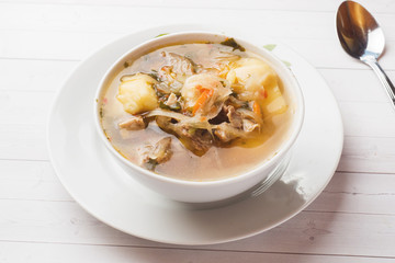 Soup of sauerkraut, meat stock in the dish.