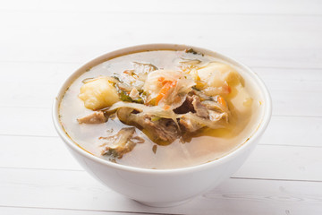Soup of sauerkraut, meat stock in the dish.