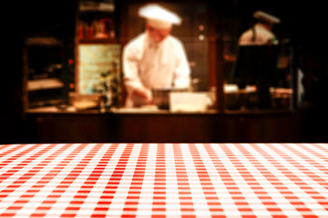 Table background of free space in restaurant interior and cook chef. 