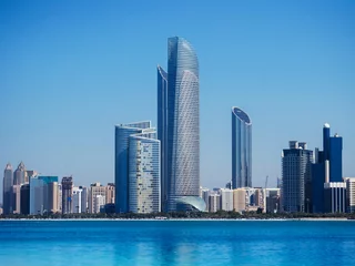 Gartenposter Blue sea at marina island with modern Abu Dhabi skyline cityscape © PixHound