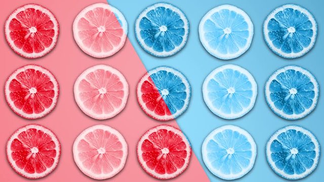 Abstract blue and red color animation of sliced lemon and grapefruit on pastel b