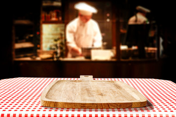 Table background of free space in restaurant interior and cook chef. 