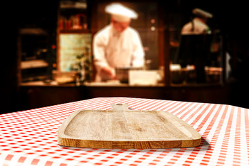 Table background of free space in restaurant interior and cook chef. 