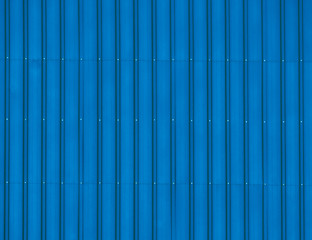 Beautiful background stainless steel corrugated sheet closeup with brushed textures in blue color