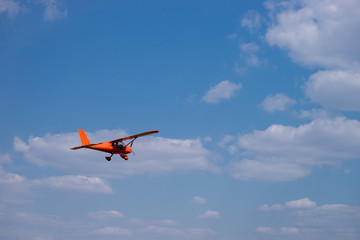 Fototapeta na wymiar Small charter aircraft flying in a blue sky