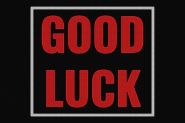 Good Luck text on dark screen