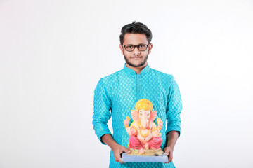 Young Indian man with Lord Ganesha , Celebrating Ganesh festival