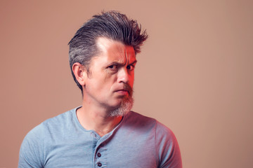 A portrait of man with half beard and hair