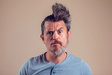 A portrait of man with half beard and hair