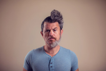 A portrait of man with half beard and hair