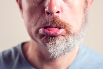 Obraz premium A portrait of man with half beard and hair