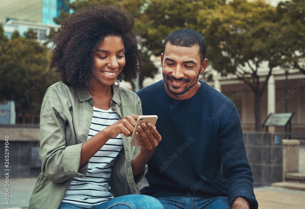 Canvas Prints man looking at his girlfriend using mobile phone