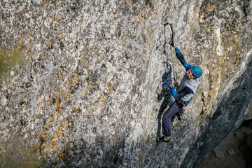 Fototapeta na wymiar Climbing man on a rock.