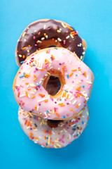 Spinkle Donuts on Colorful Background