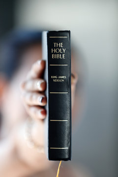 Catholic woman with the Holy Bible in hands, Vietnam