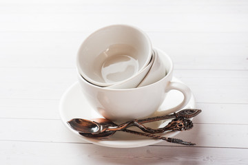 Clean dishes on table on white background.