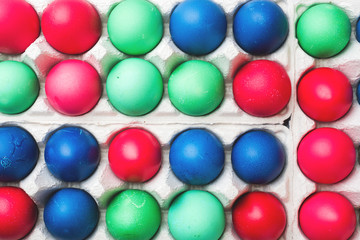 Colorful Easter eggs in paper cells. Close up.