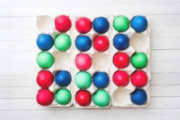 Colorful Easter eggs in paper cells. Close up.