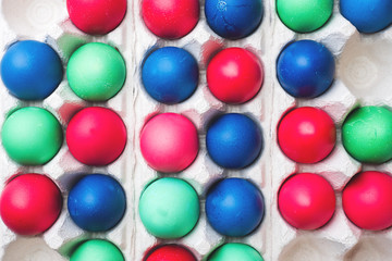 Colorful Easter eggs in paper cells. Close up.