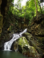 Beautiful silky smooth waterfall stream in the jungle of rainforest Sabah, Borneo.