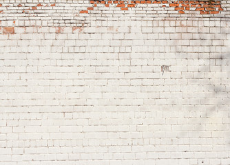 brick background,fragment of brick wall of an old building beginning to crumble
