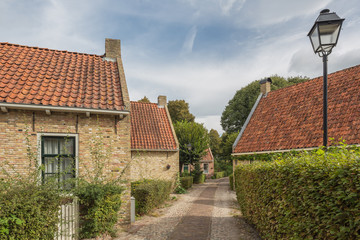 A narrow street with some houses whithin the fortification of Bourtange