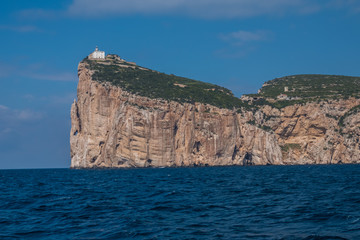 Capo Caccia, a rocky outcrop set in a protected ecosystem near the town of Alghero, Sardinia, Italy. featuring. Scenic hiking routes, diving sites & caverns with archaeological remains