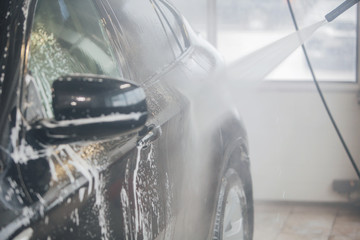 car wash. Detail of the machine in the foam close-up. the surface of the machine