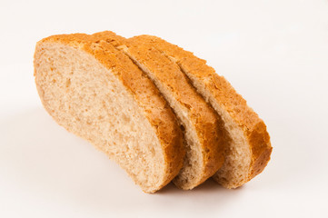 Slices of bread with bran on white background