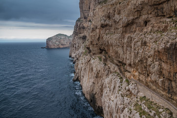 Capo Caccia, a rocky outcrop set in a protected ecosystem near the town of Alghero, Sardinia,...
