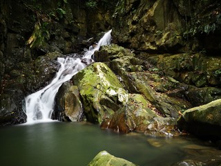 Beautiful silky smooth waterfall stream in the jungle of rainforest Sabah, Borneo.