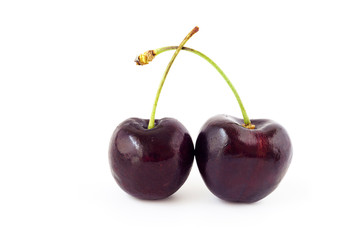 Two fresh cherries ,red cherry  isolated on a white background