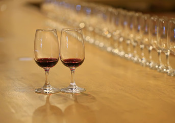 A glass of red wine is on the table