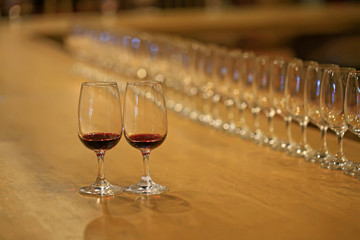 A glass of red wine is on the table