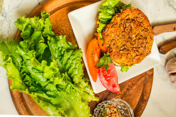 Baked vegan burgers with beans and seeds, vegetables and herbs. Healthy lifestyle and balanced food concept.