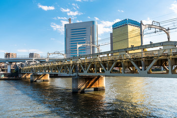 Empty Railway Bridge Over a River on a Sunny Early Spring Day. Tokyo, Japan.