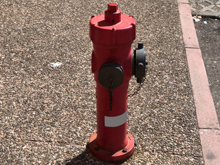 Red fire hydrant on the street close-up