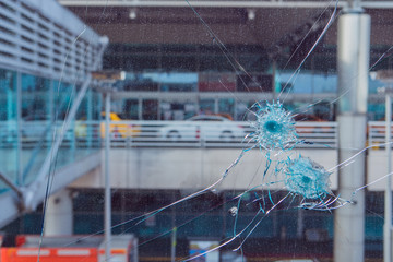 Bullet hole in glass.