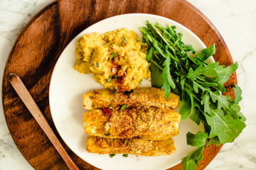 Baked Garlic Parmesan Zucchini sticks, crunchy and crispy.  Served with hummus sauce.