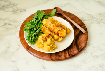 Baked Garlic Parmesan Zucchini sticks, crunchy and crispy.  Served with hummus sauce.