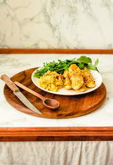 Baked zucchini sticks in crispy batter with hummus and arugula. Quick and Easy Vegetable Side Dishes. Oven-roasted Zucchini.