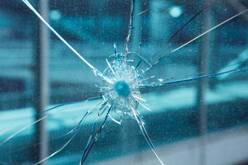 Bullet hole in glass.